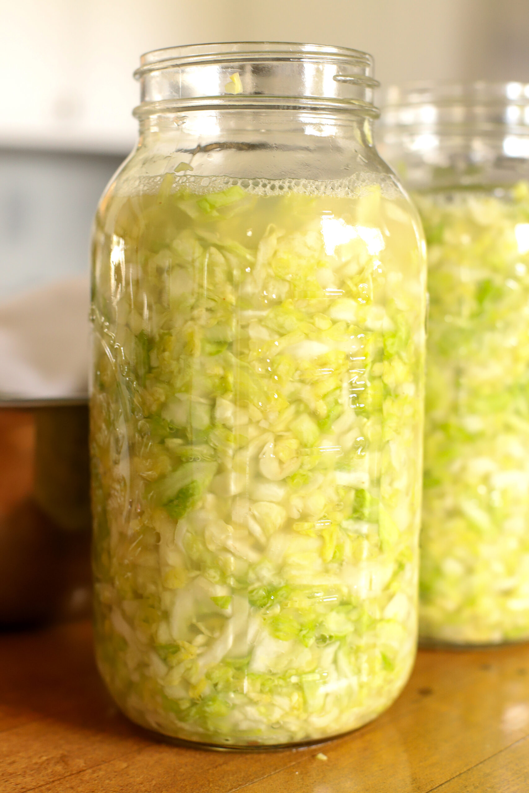 filled half gallon jar of homemade sauerkraut