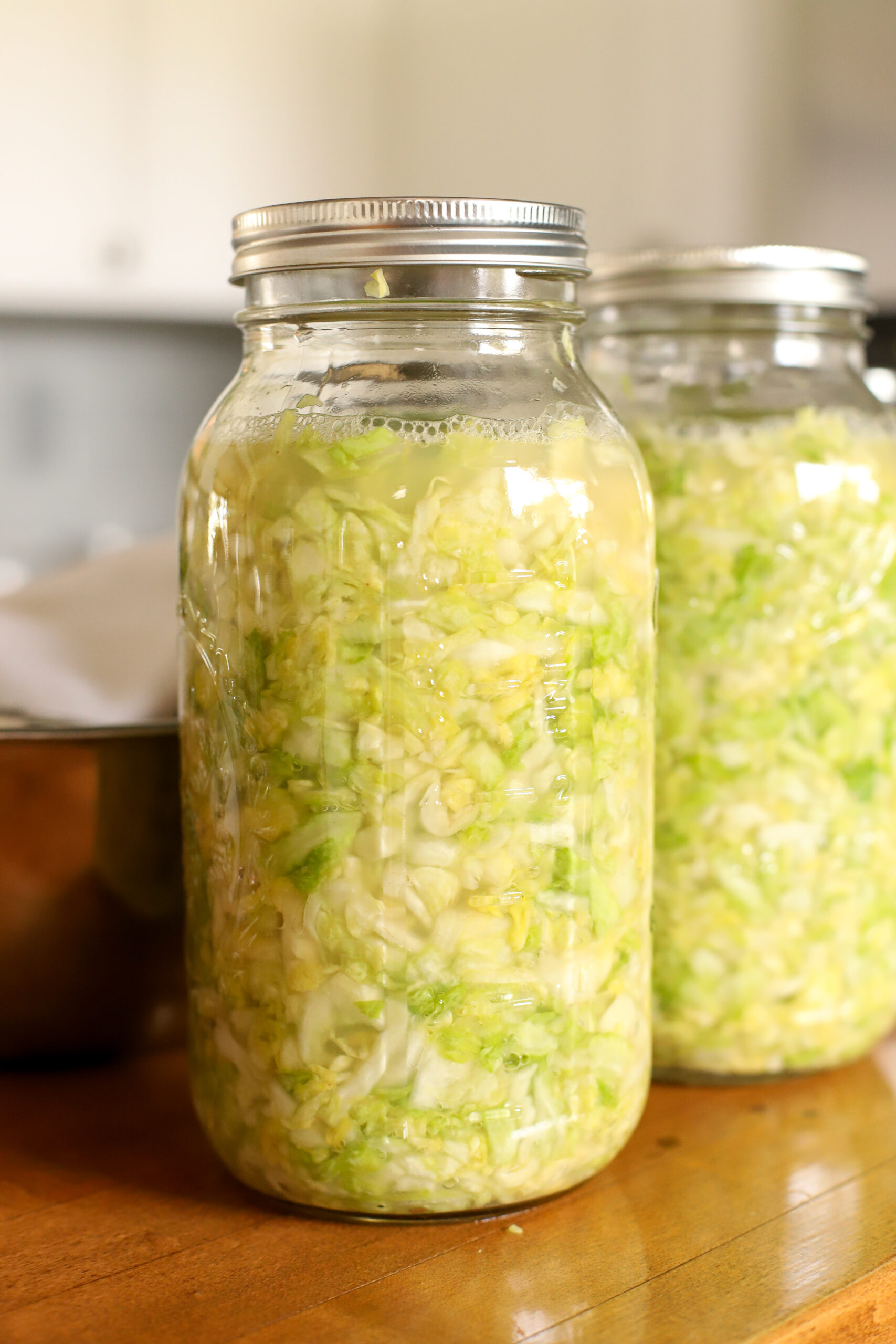 half gallon jar full of sauerkraut