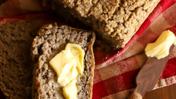 up close shot of slice of buckwheat bread slathered in butter