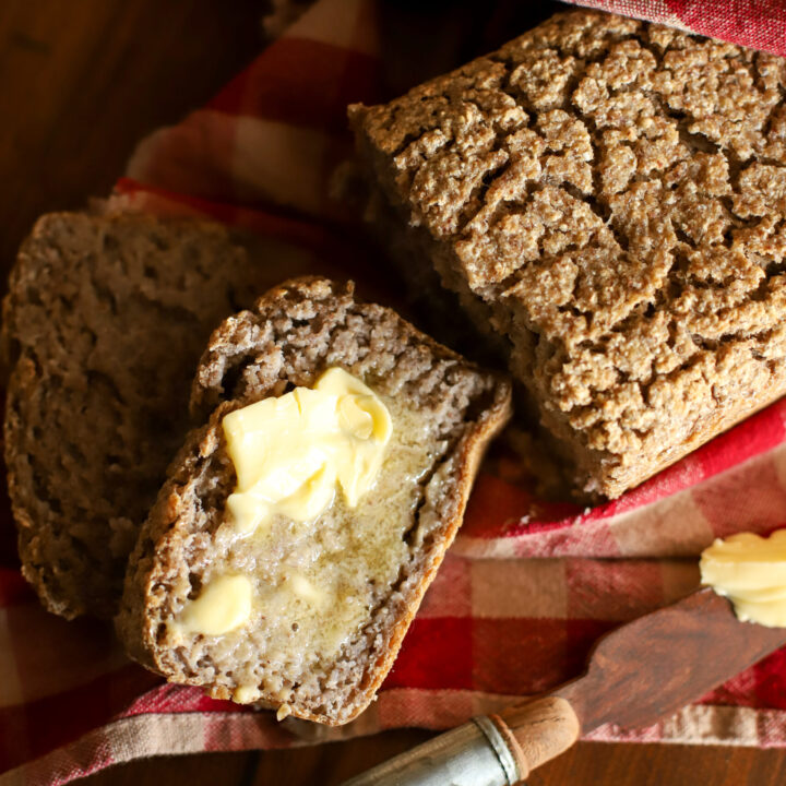 up close shot of buckwheat bread slathered in butter