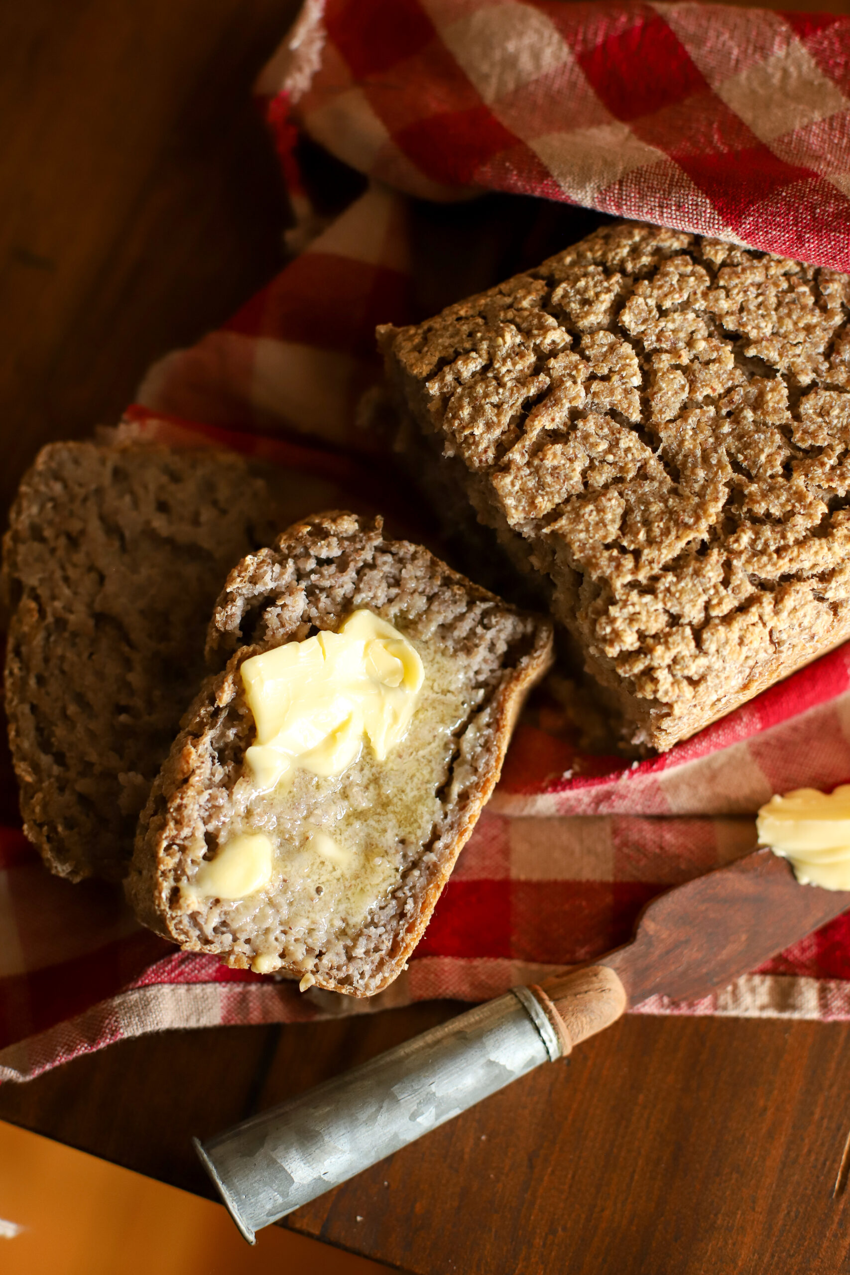 up close shot of buckwheat bread slathered in butter