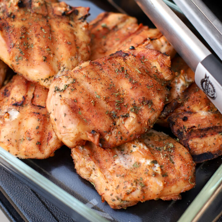 plate of smoked chicken breasts right off the smoker