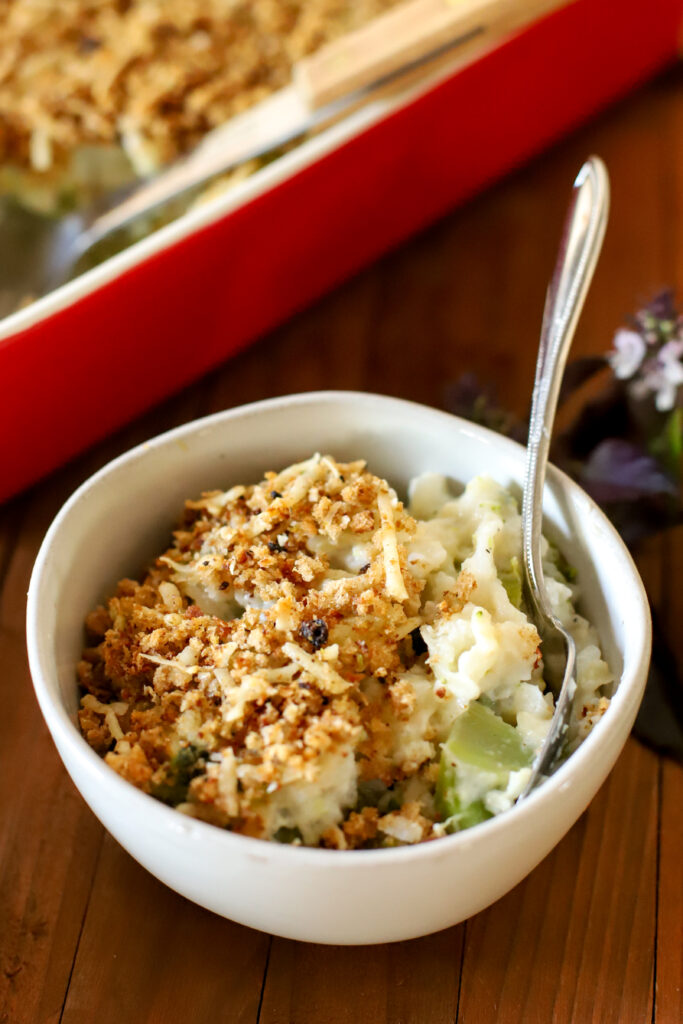 up close shot of bowl of broccoli rice casserole