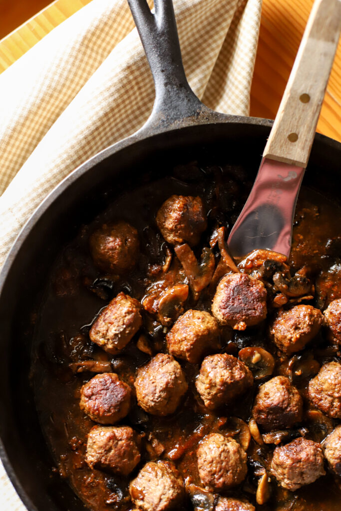 beef meatballs in brown gravy cooked in cast iron