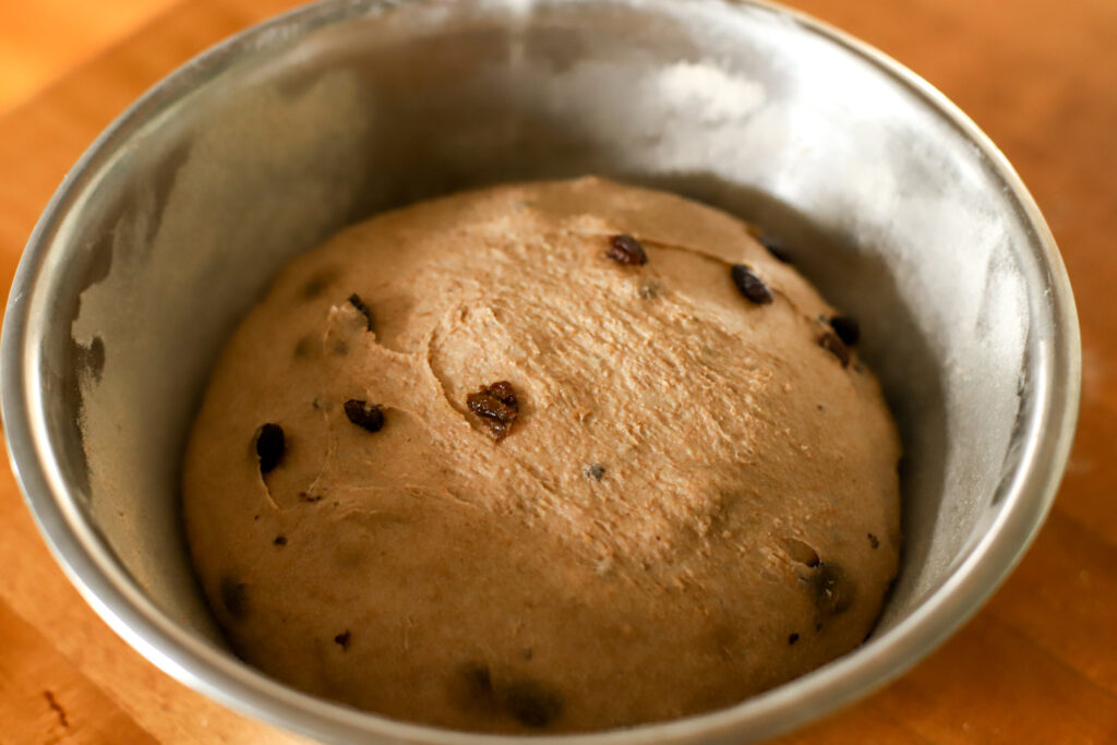 up close shot of risen sourdough cinnamon raisin bread