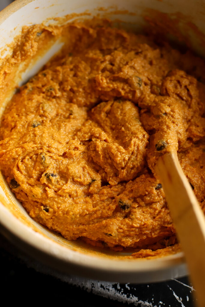 up close shot of bowl of pumpkin chocolate chip muffin batter