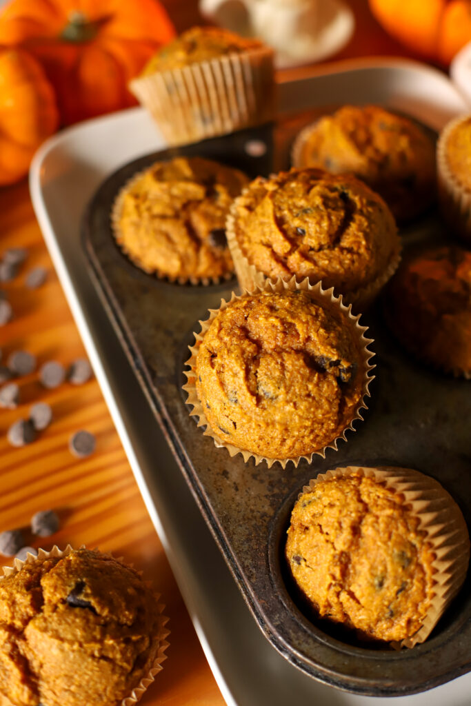 up close shot of freshly milled pumpkin chocolate chip muffins