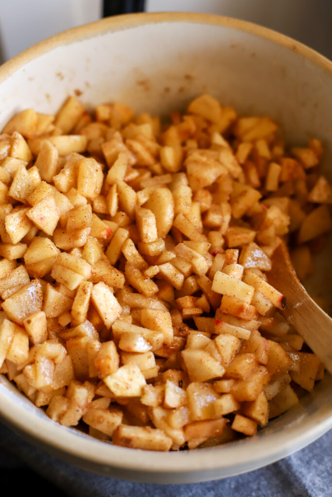up close shot of diced apples with sugar and spices