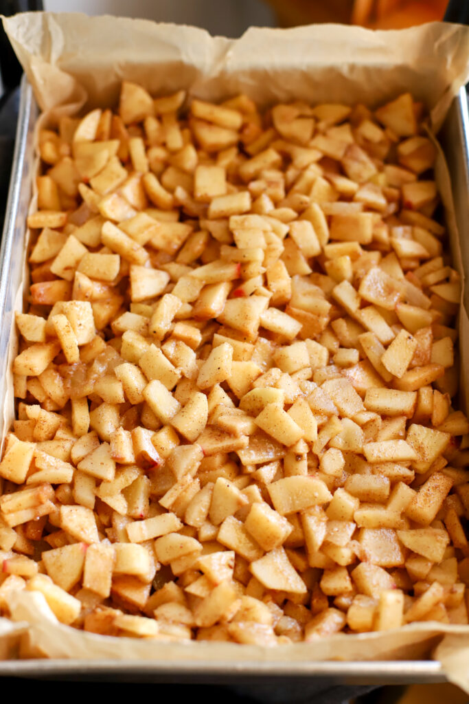 up close shot of apple pie filling in a baking pan