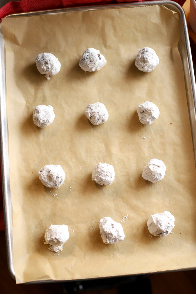 fresh milled crinkle cookies on a baking sheet