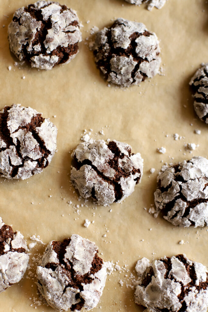 Up close shot of crinkle cookies on baking sheet