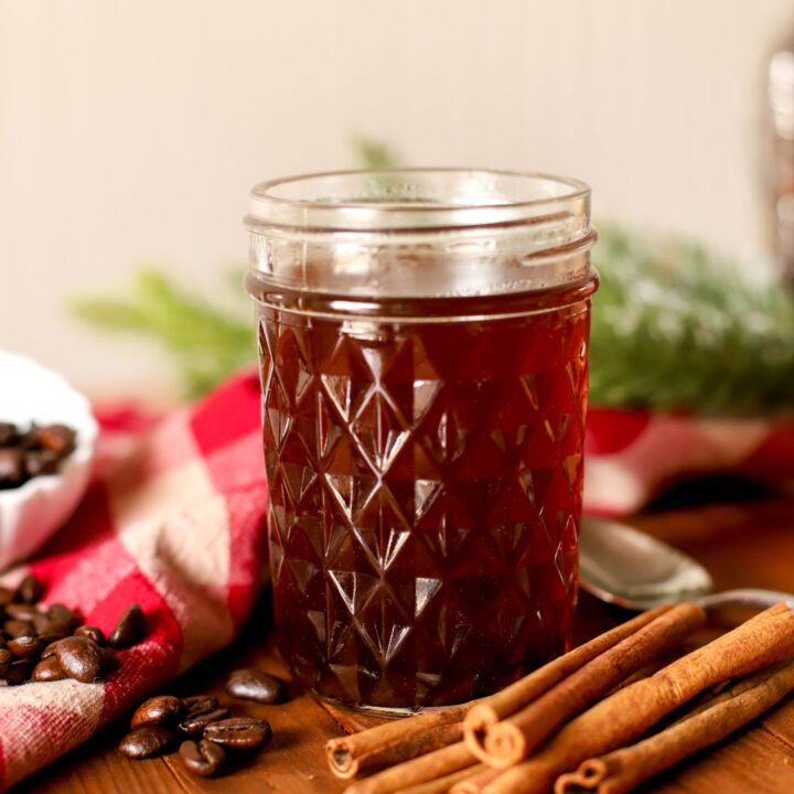 up close image of jar filled with maple cinnamon simple syrup