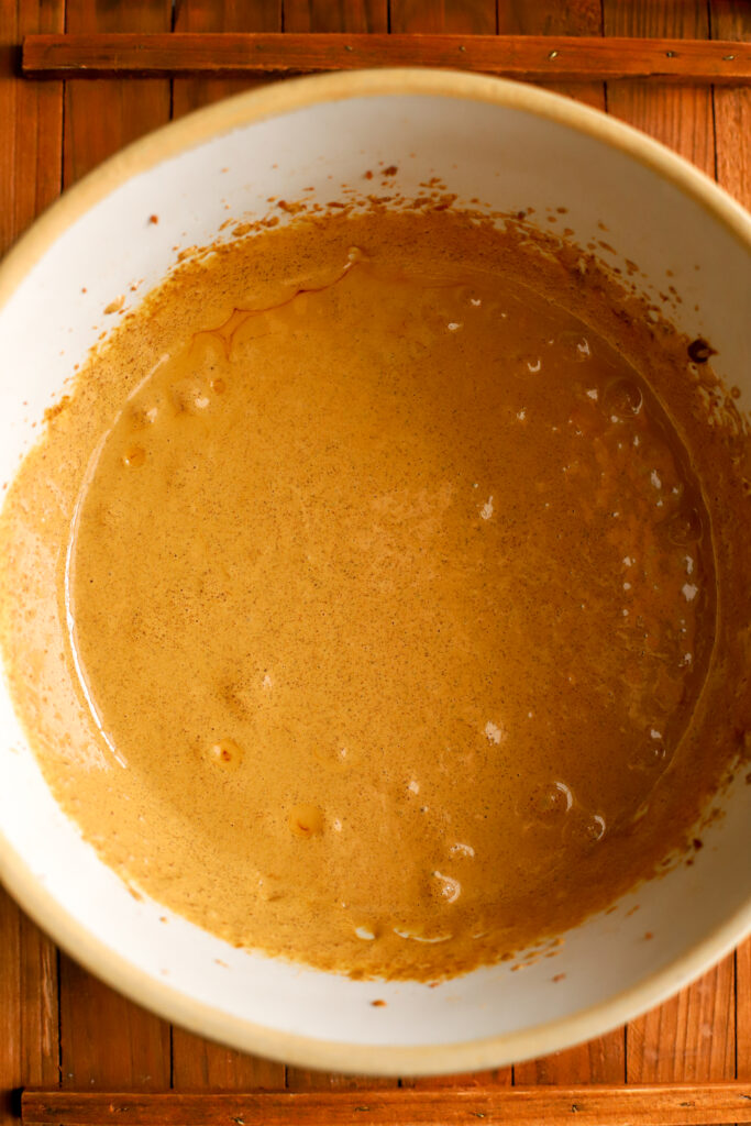 up close shot of whipped eggs and sugar in a bowl