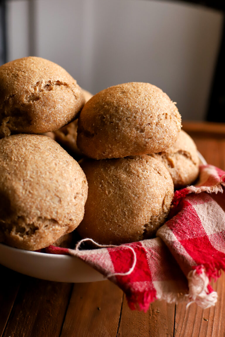 up close shot of bowl full of fresh milled sourdough dinner rolls