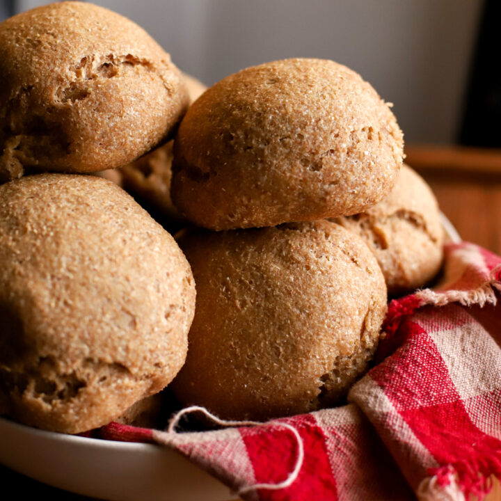 up close shot of bowl full of fresh milled sourdough dinner rolls