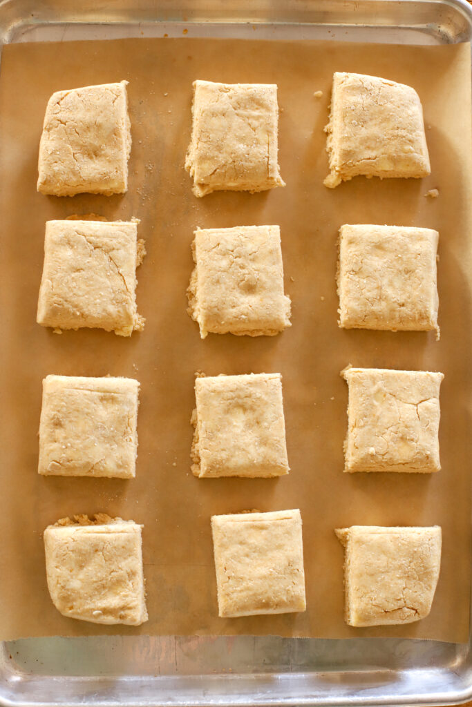 up close shot of fresh milled biscuits on a baking sheet ready to bake