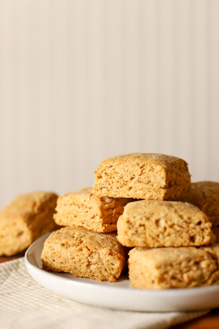 up close shot of fresh milled biscuits stacked on a plate