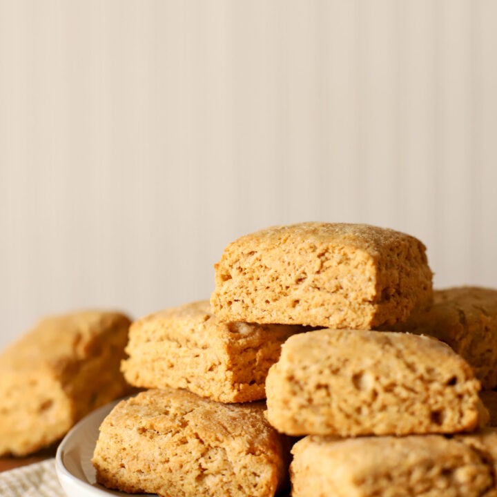 up close shot of fresh milled biscuits stacked on a plate