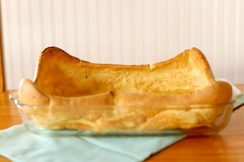 up close shot of baked fresh milled german pancakes in a pan