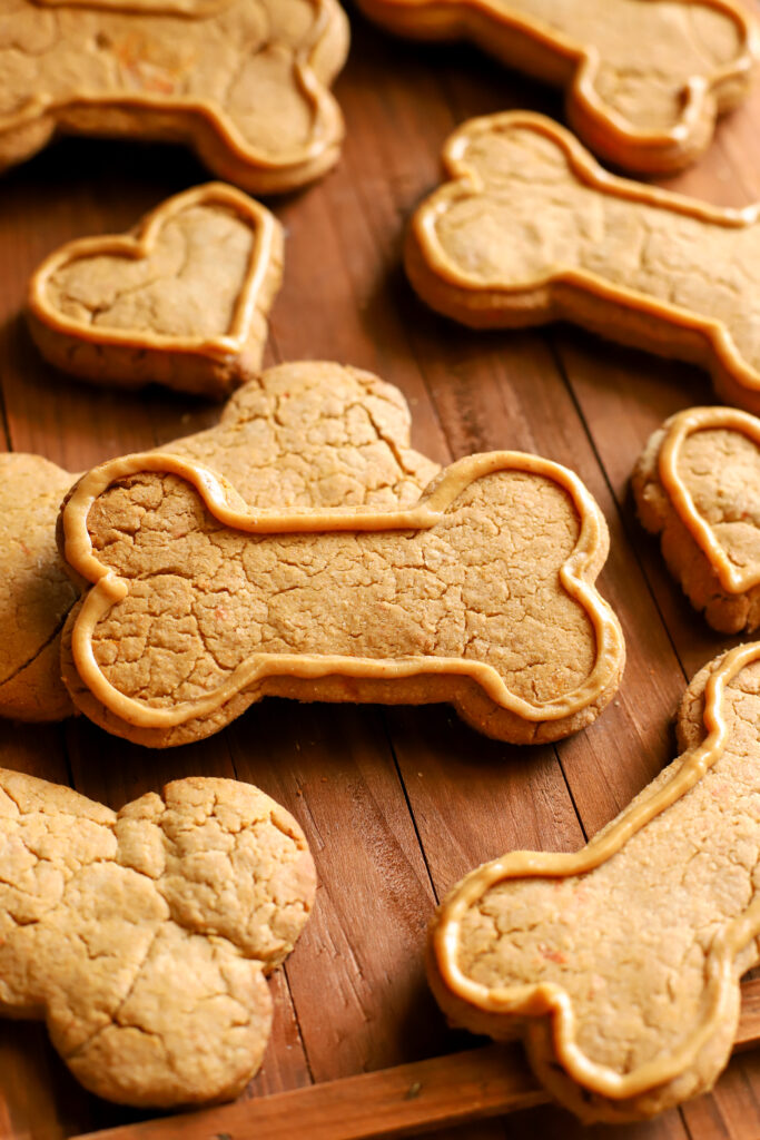 up close shot of a wooden tray full of homemade dog treats