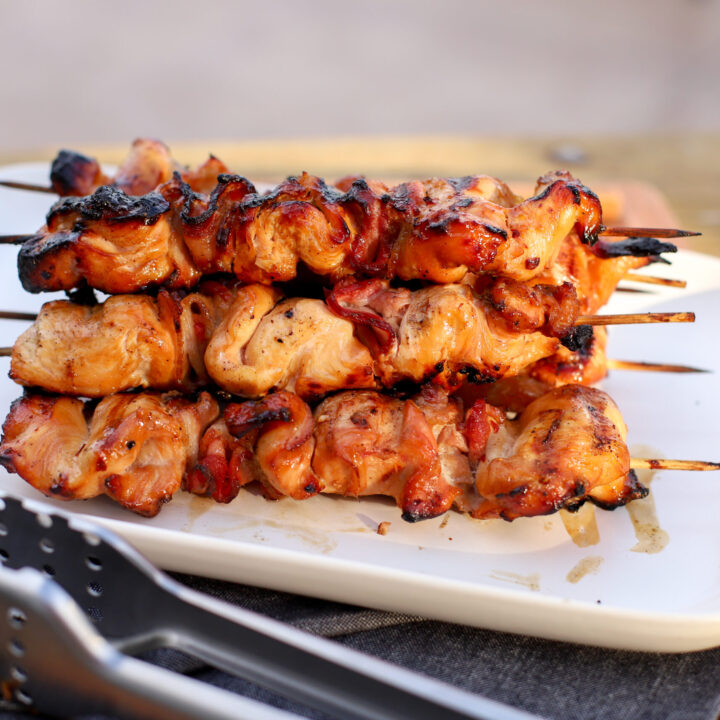 up close shot of smoked chicken kebabs on a serving tray