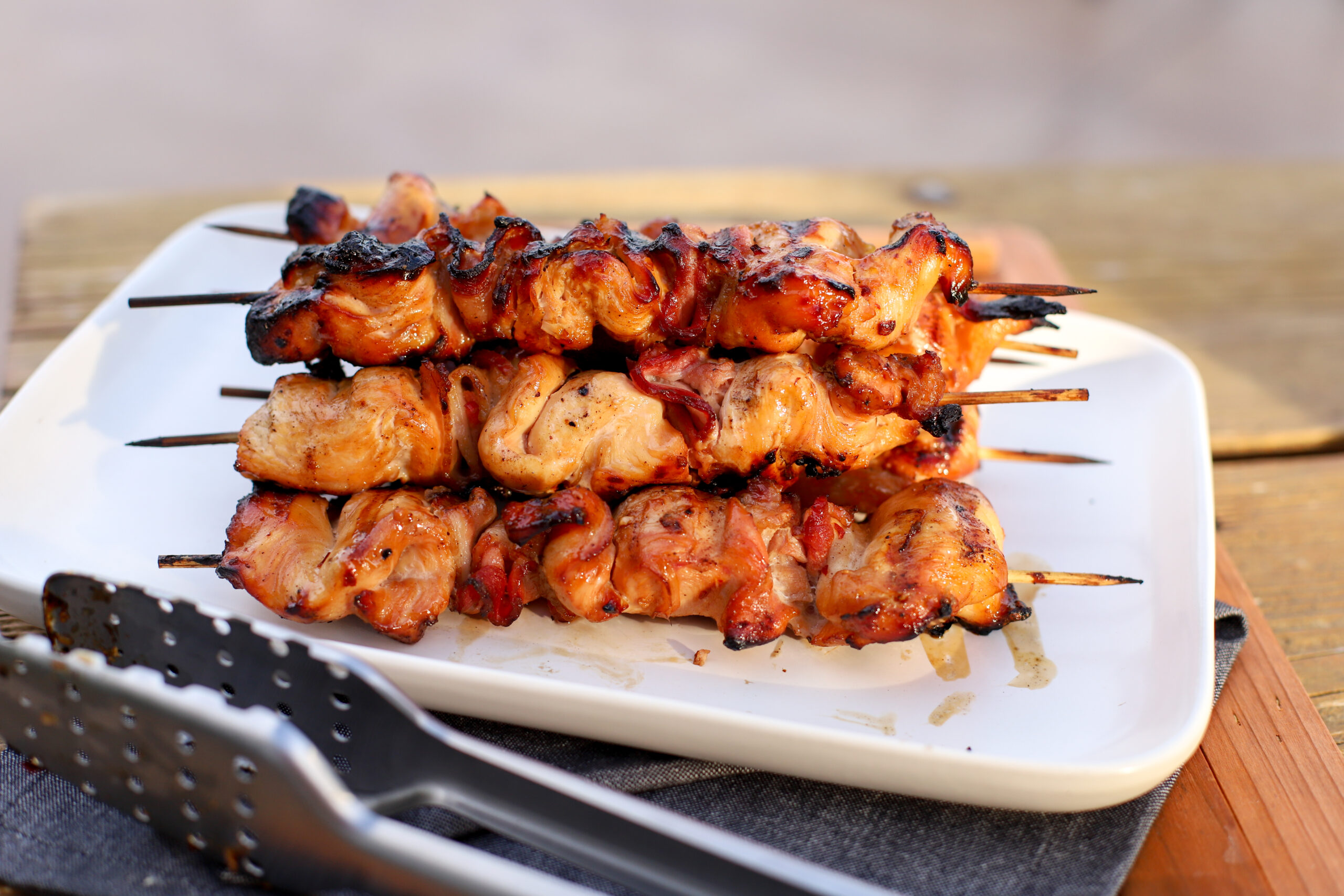 up close shot of smoked chicken kebabs on a serving tray