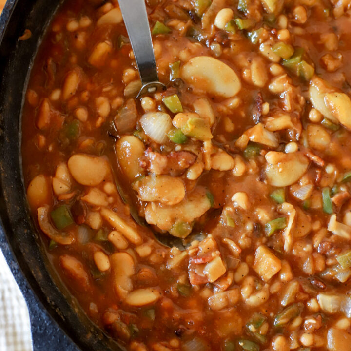 up close shot of a cast iron pan with homemade baked beans