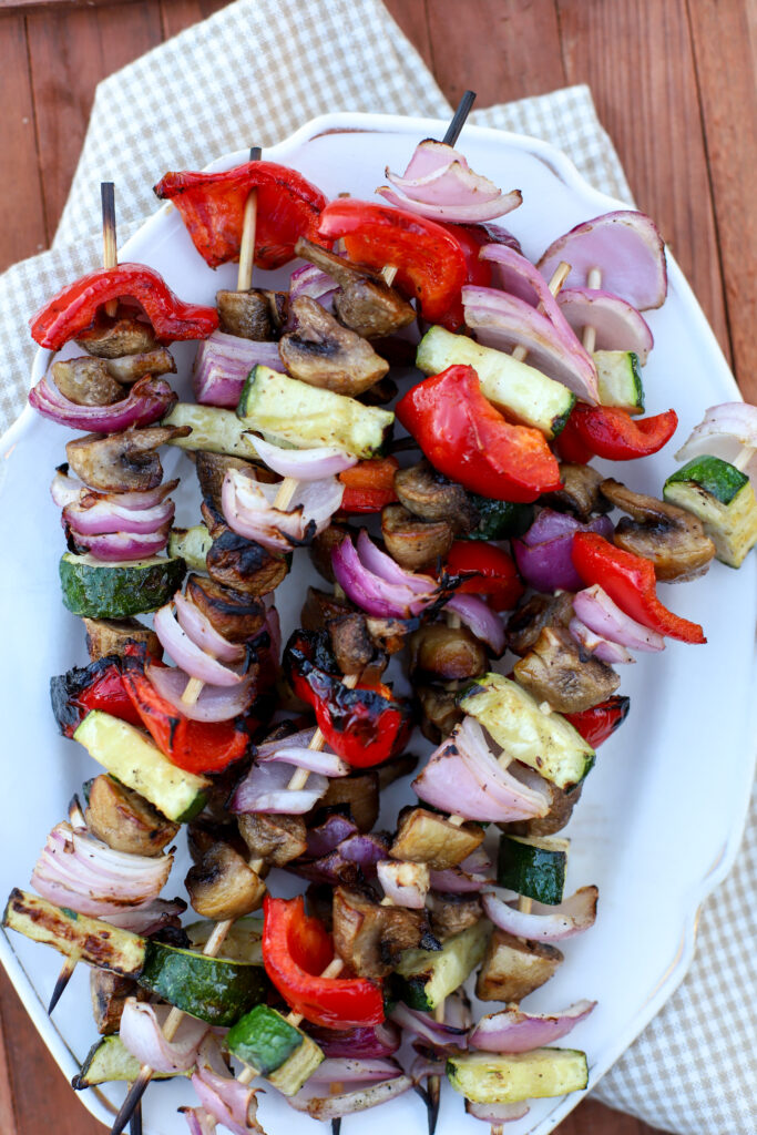 up close shop of a plate of vegetable skewers