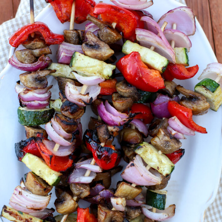 up close shop of a plate of vegetable skewers