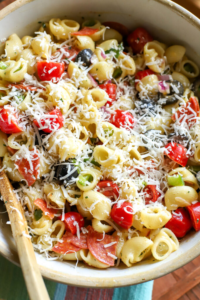 Easy pasta salad with homemade Italian dressing in a bowl with shredded parmesan on top